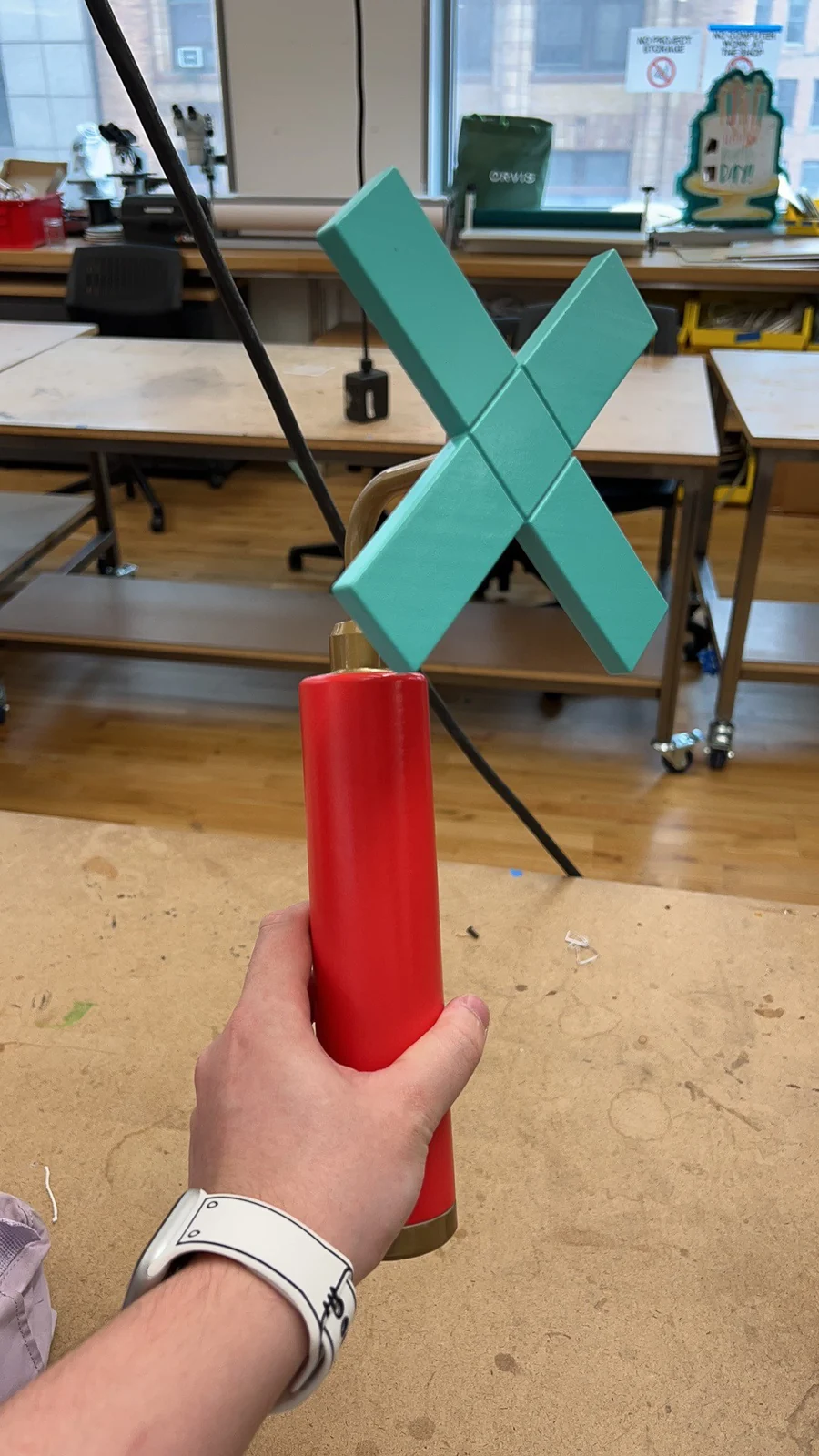 The assembled Chill-out Stick with a red handle and turquoise head