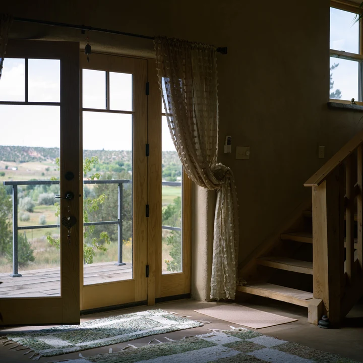 Sunlight through open doors in a quiet room