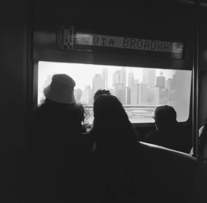 Silhouettes watching a screen in a dark room