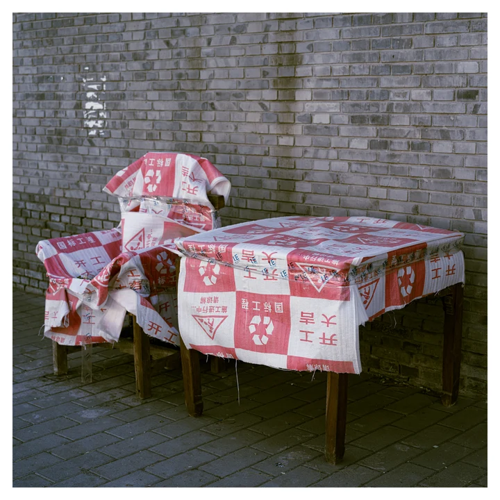 A table and chairs covered in patterned fabric