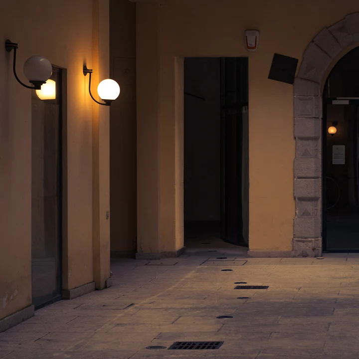 Warm lamps lighting a quiet passage