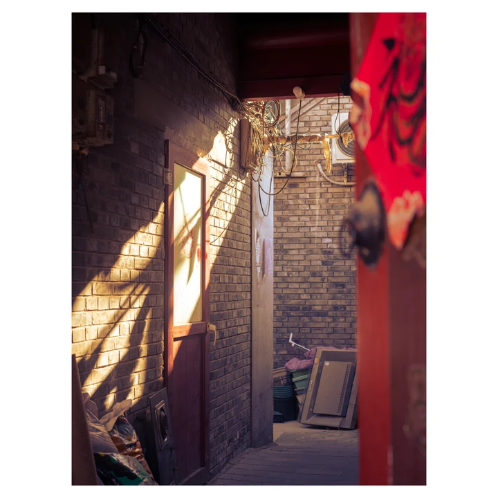 Sunlight across carved doors