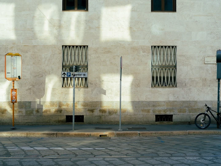 Window shadows across a pale building