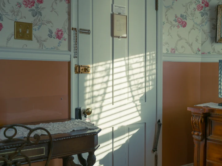 Sunlight across a window and interior door