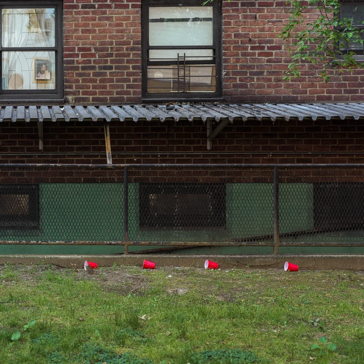 A brick building beside a green verge