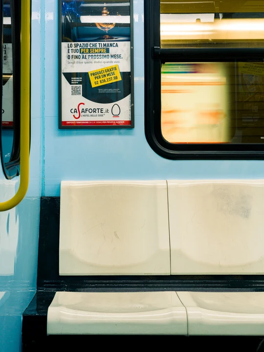 A train doorway and illuminated window