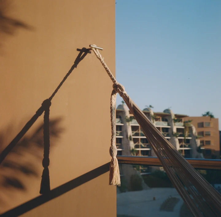 A raised barrier beside a sunlit building