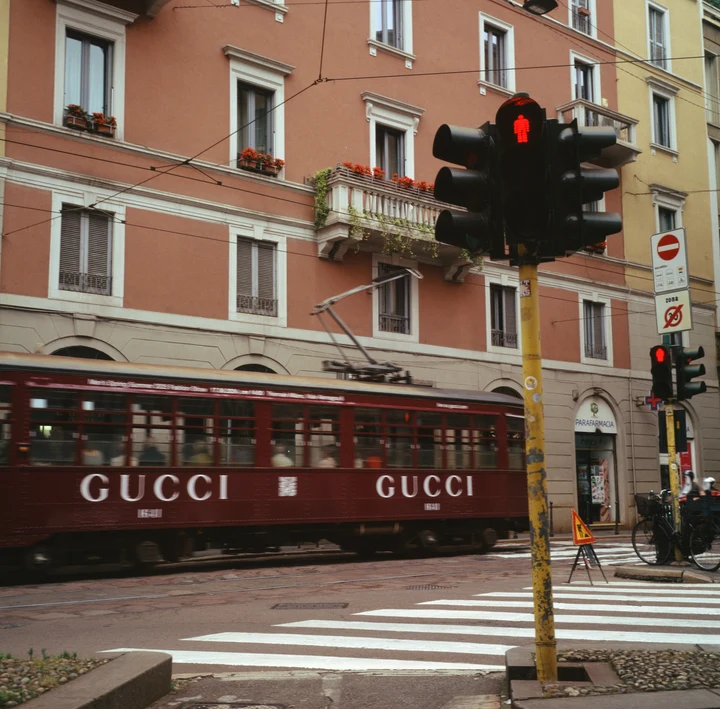 A traffic signal in front of a city storefront